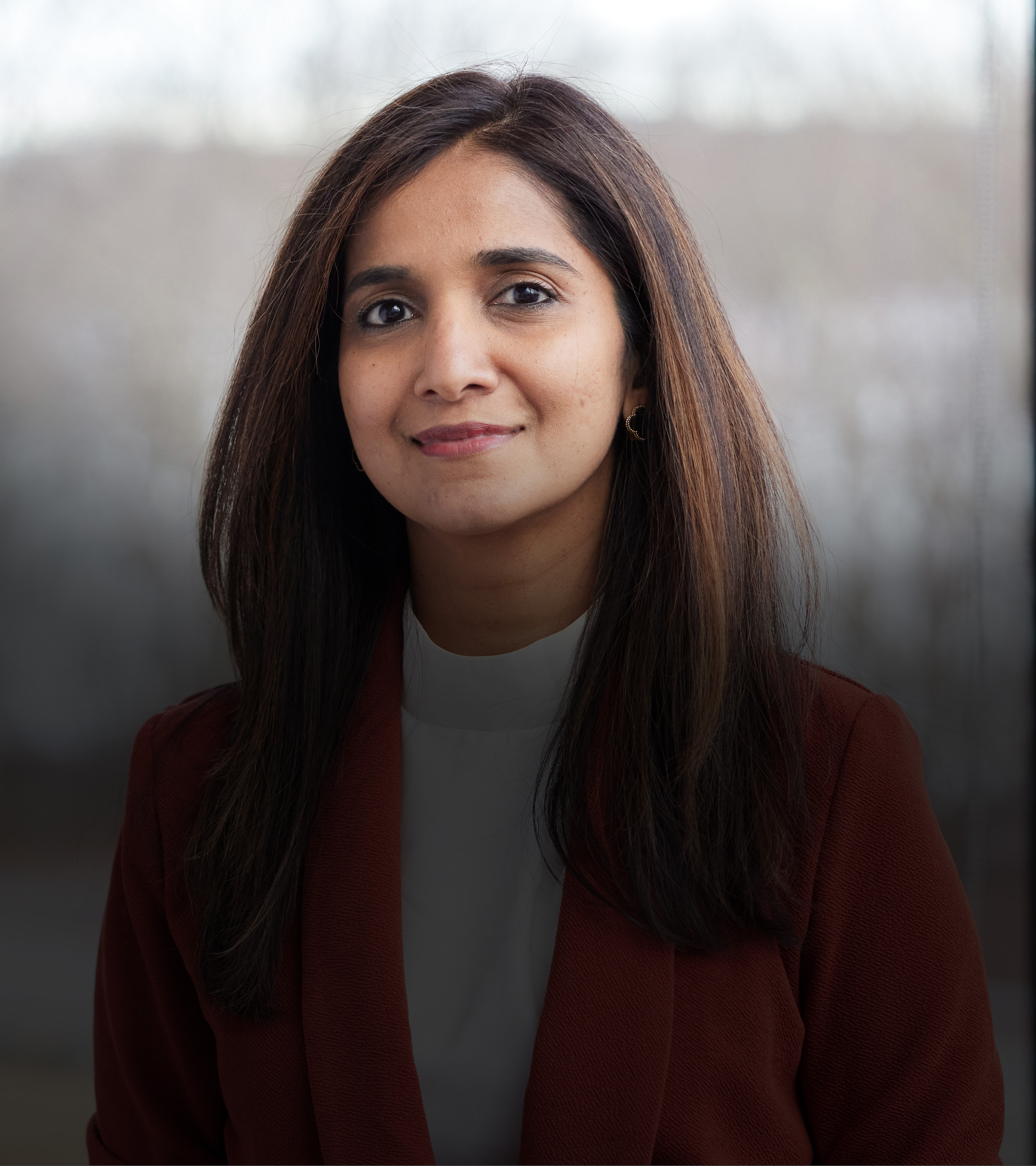 portrait of woman smiling in office setting
