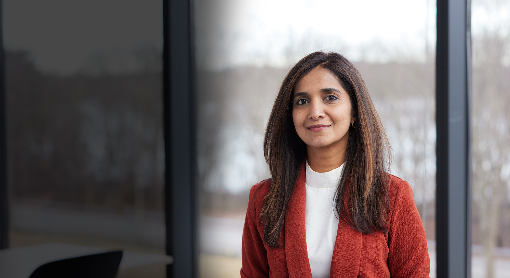 portrait of woman smiling in office setting