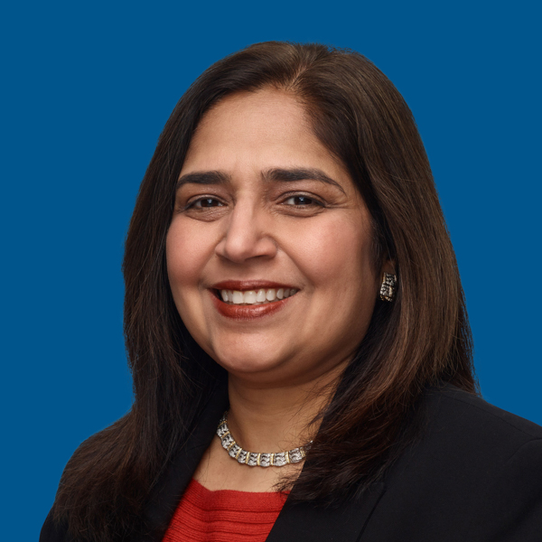 Headshot of Kanchan Relwani, blue background