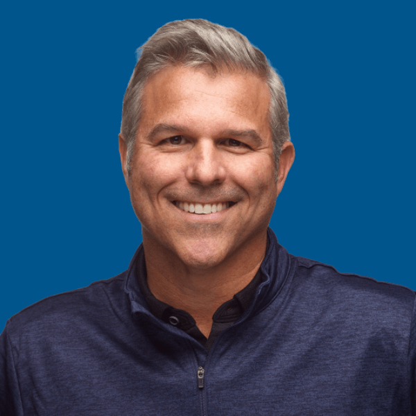 Headshot of Jeff Harris, blue background