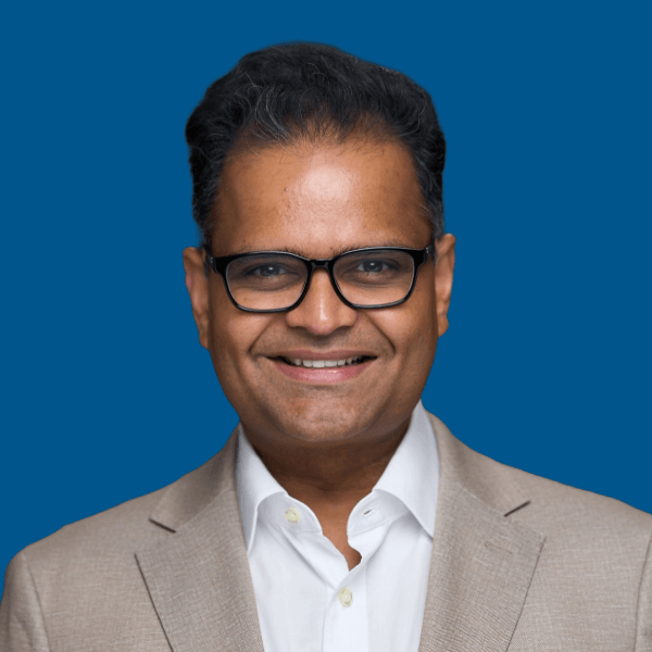 reg Headshot of Bhaskar Rege, blue background