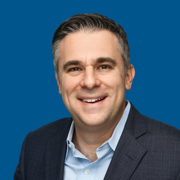 Headshot of Stephen Schiavo, blue background