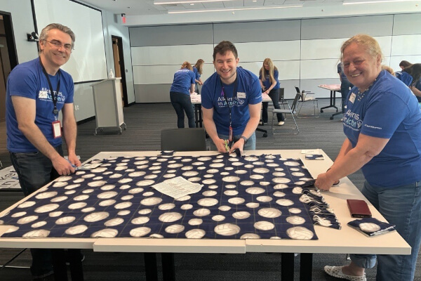 Alkermes employees making blankets for people in need
