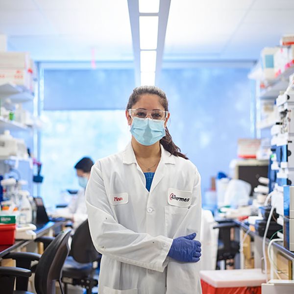 Portrait of employee standing in lab